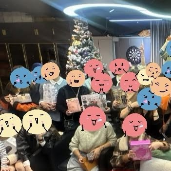 Group photo at an indoor team gathering with festive decorations